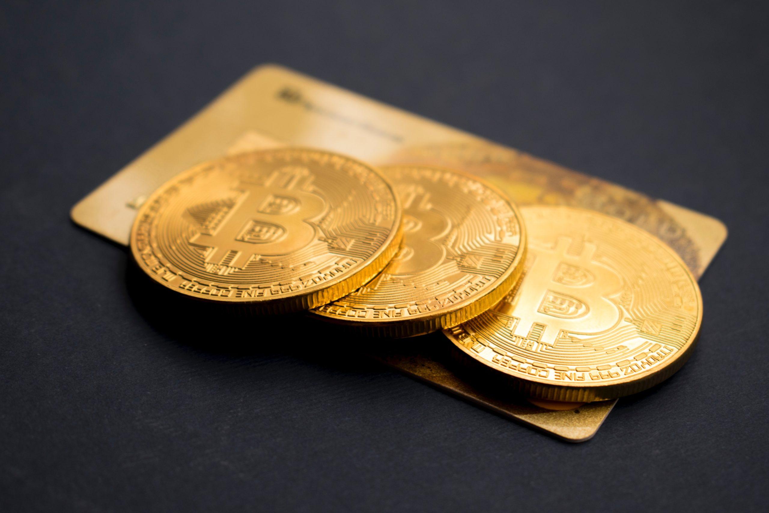 gold crypto coins on credit card