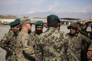 U.S. Soldier talks to a small group of Afghan National Army (ANA) Soldiers during a class
