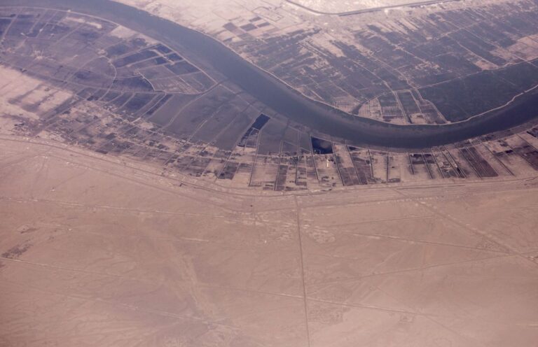 Doing Business in Iraq. Discover How Proelium Law Can Offer Comprehensive Legal Support For Your Organisation to Succeed in This High-Risk Environment.- Aerial view from plane